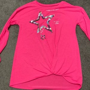 Pink shirt with a sequence star